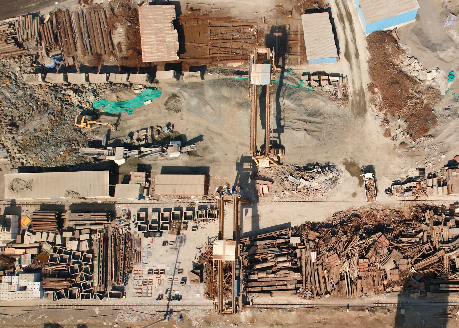 an aerial view of a construction site with a crane